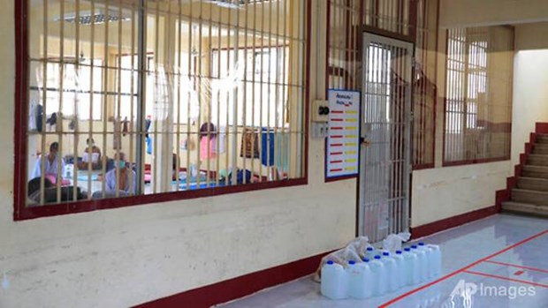 In this photo released by Department of Corrections, prisoners sit inside a field hospital set up at Medical Correctional Institution to treat COVID-19 inmates, in Bangkok, Thailand, on May 8, 2021. (Photo: Department of Corrections, Thailand via AP)