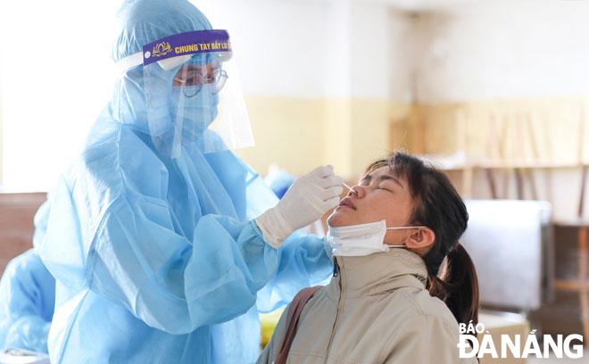 Taking swab samples for SARS-CoV-2 testing at the Da Nang Family Hospital