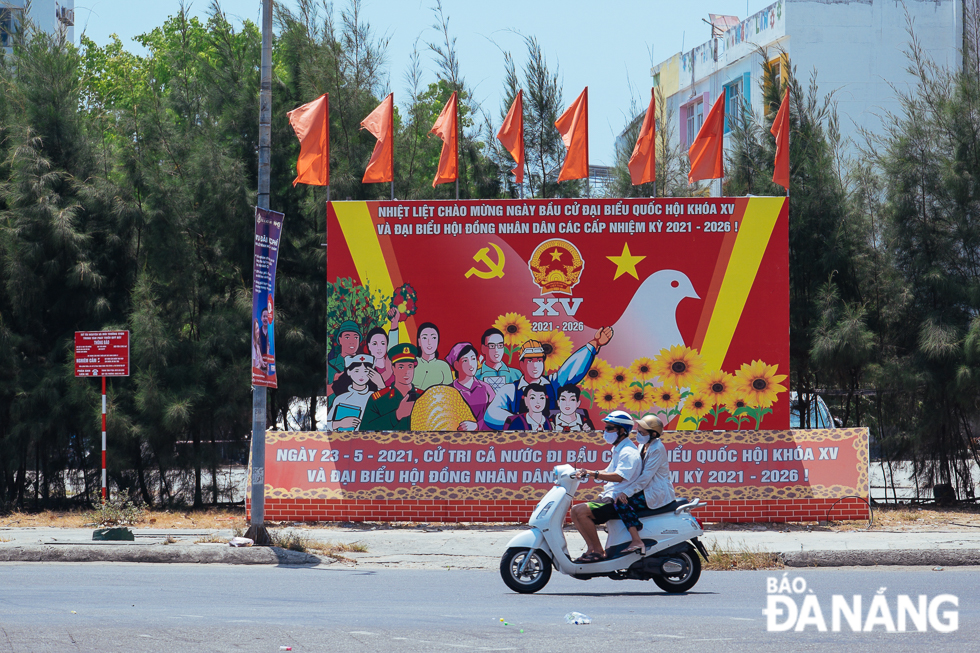 A chain of panels enlightens a section of Hoang Dieu Street.