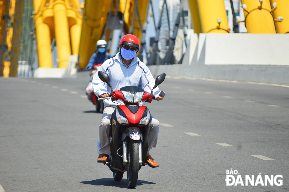 Road users donning face masks whilst going out.