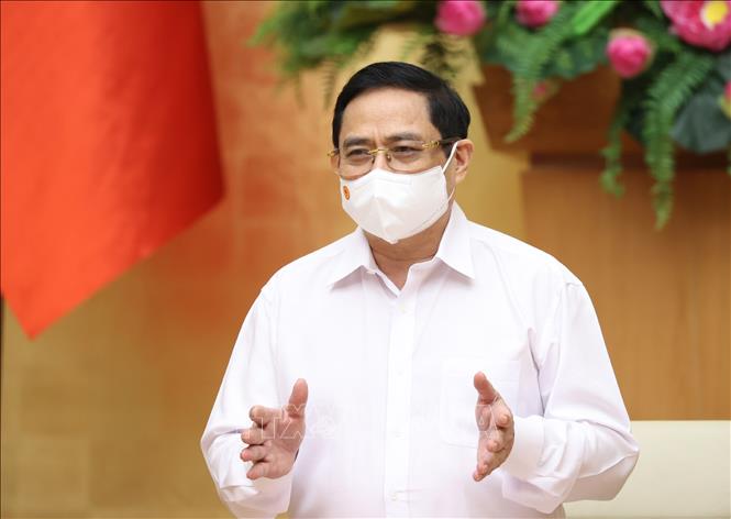 Thủ tướng Phạm Minh Chính yêu cầu người dân, công nhân các khu công nghiệp thực hiện nghiêm các các biện pháp phòng, chống dịch. Ảnh: Dương Giang/TTXVN