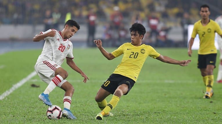 Trận đấu giữa UAE (áo trắng) với Malaysia ở lượt đi hồi năm 2019. Ảnh: Sportskeeda