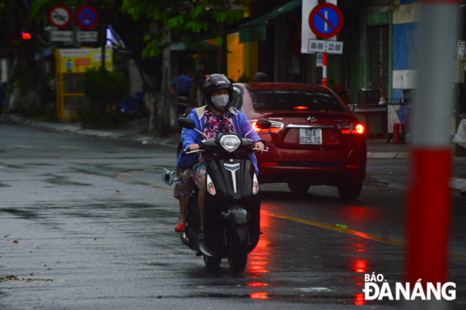   The rain cools the city’s mercury down