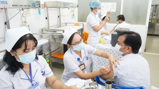 COVID-19 vaccine jabs being administered for frontline workers in Việt Nam. — VNA/VNS Photo