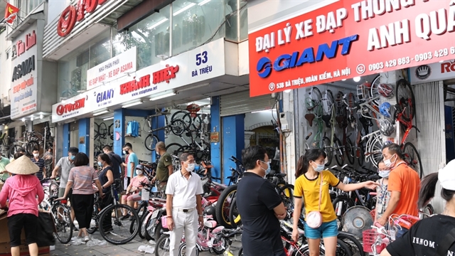 Many customers rush to bike shops on Bà Triệu Street to buy bikes for physical exercise. — VNS Photo Minh Phương