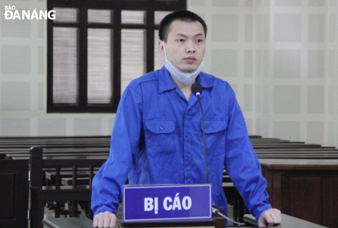 Bị cáo Xiao Guiping tại phiên tòa sơ thẩm. Ảnh: LÊ HÙNG 