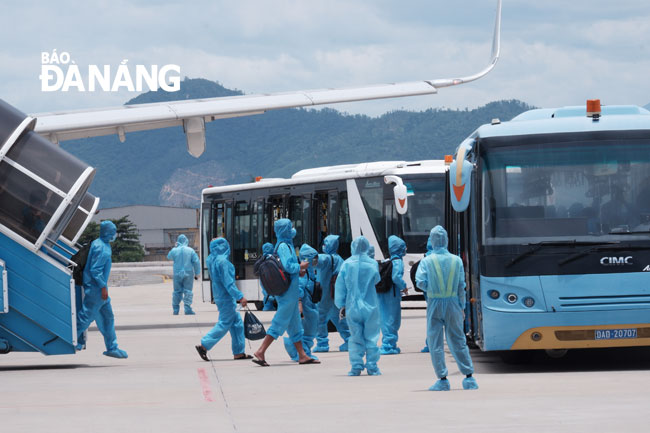  Functional forces are seen on duty at the airport to guide the passengers to board a transit vehicle.