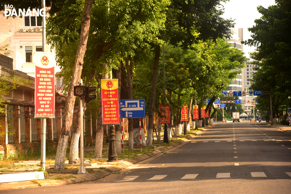 Banners and slogans are decorated along an empty Tran Phu Street. Photo: TRONG HUY