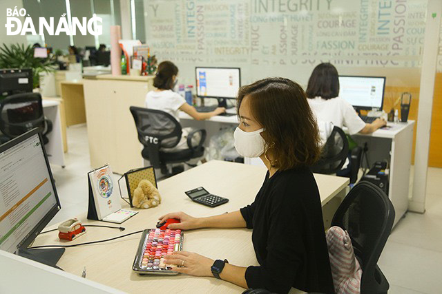 Working ambiance observed at the Da Nang branch of the FPT Software Co., Ltd Photo: THU HA