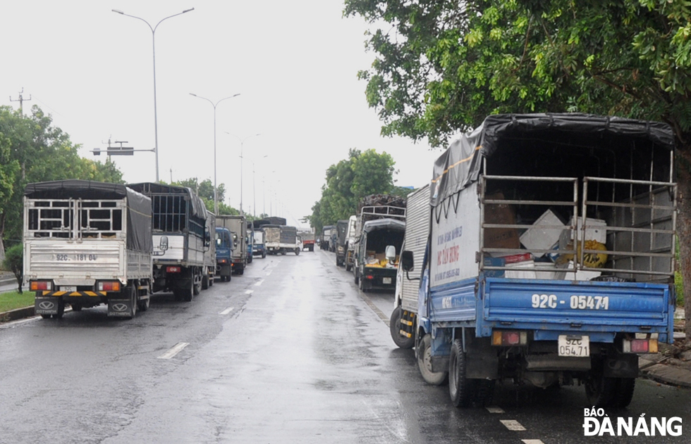 After parking their vehicles, drivers are subject to the sample collection for rapid antigen testing.