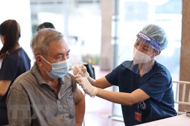 A man gets vaccinated against COVID-19 in Ha Noi's Hoan Kiem district. (Photo: VNA)