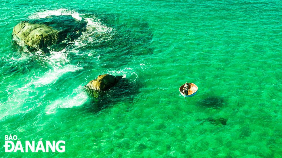 The beach boasts jade-green waters