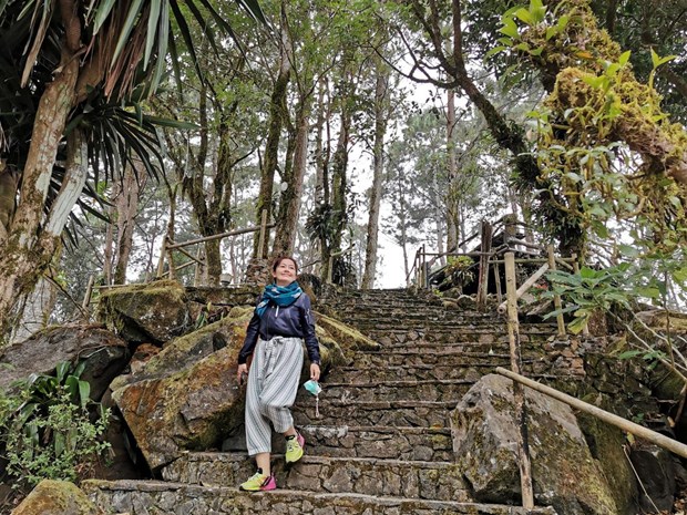 A tourist enjoys the scenic view in Mae Fah Luang Arboretum in Chiang Rai. (Photo: Pongpet Mekloy via Bangkok Post)