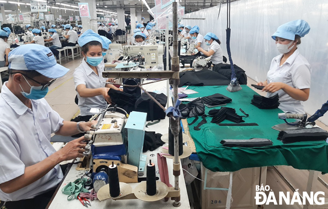 In the photo are workers at the 29 March Textiles and Garment Company. Photo by KHANH HOA