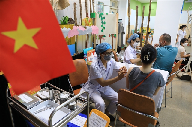 People in Hà Nội get vaccinated on Thursday. Viêt Nam has achieved the milestone of administering 50 million COVID-19 vaccine doses on Thursday