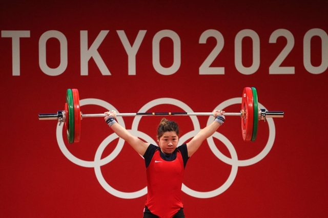Lifter Hoàng Thị Duyên of Việt Nam competes during the women's 59kg class of the Tokyo 2020 Olympic Games on July 27. Duyên could not win a top-three place in Tokyo but is still Việt Nam's hope at the next Olympic Games. A
