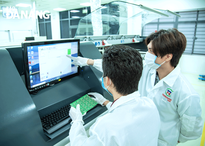 Engineers are seen at SMT high-tech electronics research and production factory (Trungnam EMS) located in the Da Nang Hi-Tech Park. Photo: PHUONG UYEN