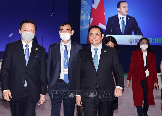 Thủ tướng Phạm Minh Chính và các thành viên Đoàn đại biểu Việt Nam tại Hội nghị của Liên hợp quốc về biến đổi khí hậu (COP26). Ảnh: Dương Giang/TTXVN