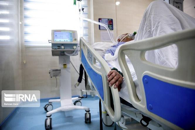  Bệnh nhân Covid-19 được điều trị tại bệnh viện ở Iran. Ảnh: IRNA/ TTXVN