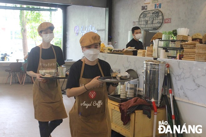 Angel Café’s employees are mostly deaf and mute. Photo: XUAN SON