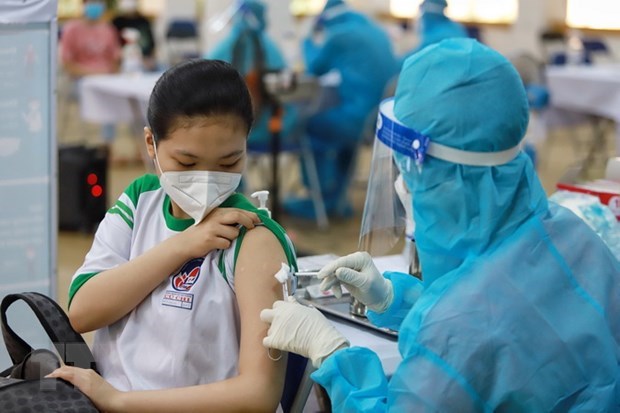 A student in HCM City's Cu Chi district gets vaccinated against COVID-19 (Photo: VNA) 