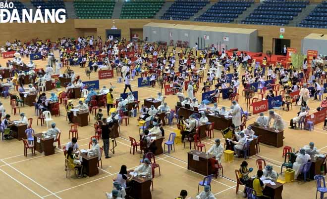 Picture was taken at a vaccination location in the Tien Son Sports Arena on Saturday morning. Photo: NGOC HA