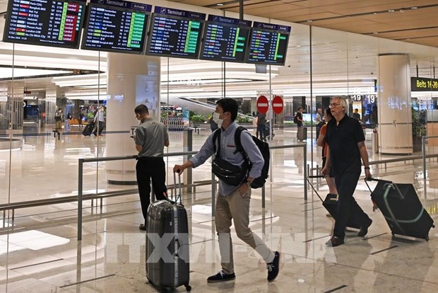 Passengers at Singapore's Changi Airport. (Photo: AFP/VNA)