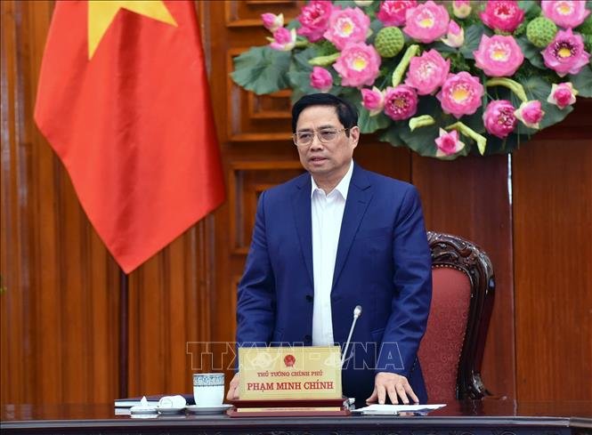 Thủ tướng Chính phủ Phạm Minh Chính chủ trì cuộc họp với thành phố Đà Nẵng tại đầu cầu Hà Nội. Ảnh: TTXVN 