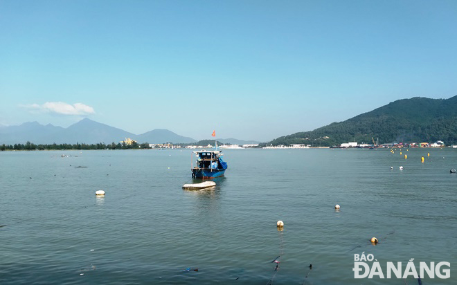 The Man Quang Bay looks clear after spontaneous and illegal aquaculture structures are dismantled. Photo: HOANG HIEP