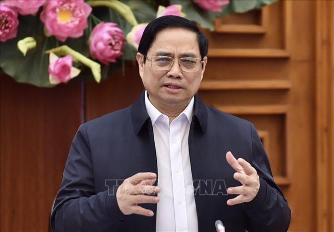 Thủ tướng Phạm Minh Chính chủ trì cuộc họp về thúc đẩy sản xuất vaccine. Ảnh: Dương Giang/TTXVN