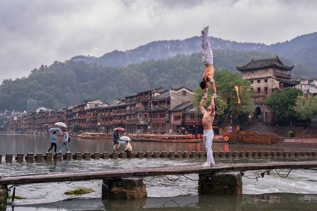 The Giang brothers in Fenghuang Guzhen, China, in 2019. — Photo courtesy of the Giang brothers