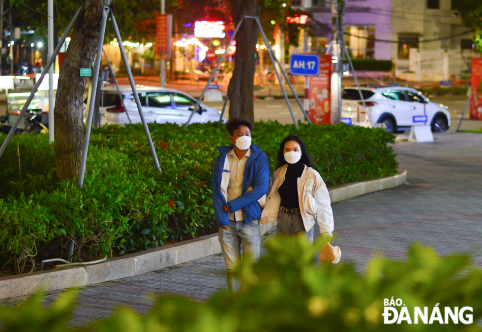 People are seen wearing face masks when going to public places.