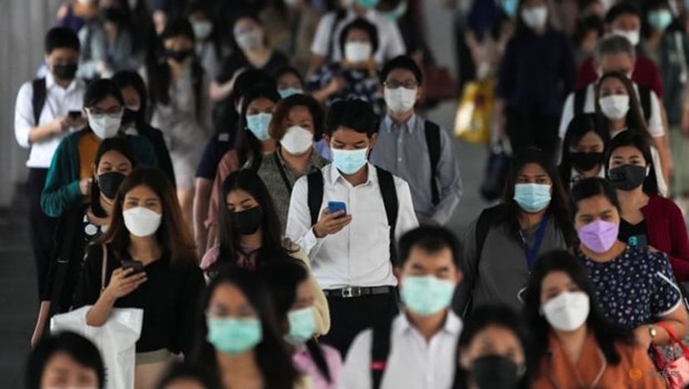 People wearing face masks as a measure to prevent the spread of COVID-19 are seen at a train station in Bangkok on Nov 29, 2021. (File photo: Reuters)