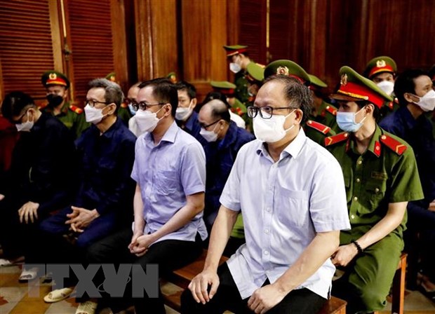Các bị cáo tại phiên tòa ngày 4-1-2022. (Ảnh: Thành Chung/TTXVN)