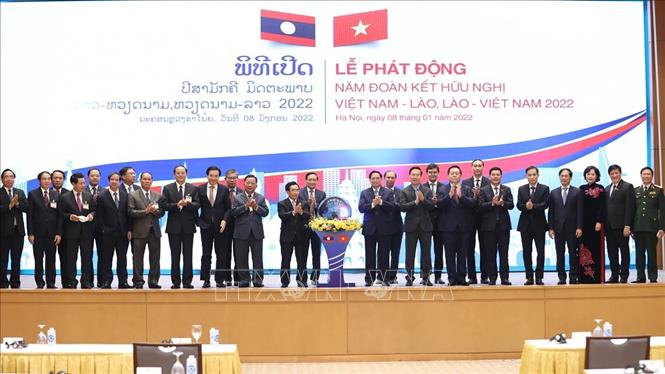 Thủ tướng Phạm Minh Chính và Thủ tướng Lào Phankham Viphavanh cùng đại biểu hai nước tại Lễ phát động Năm Đoàn kết Hữu nghị Việt Nam - Lào, Lào - Việt Nam 2022. Ảnh: Dương Giang/TTXVN.