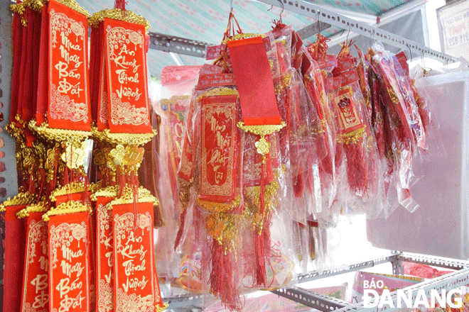 Strings of hanging decorative items are being priced at between VND10,000 and VND25,000 each. Photo: QUYNH TRANG 