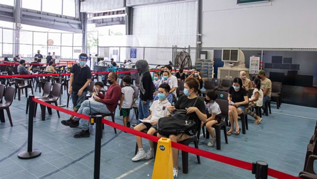 Families with children prepare to receive their COVID-19 vaccination at Our Tampines Hub vaccination centre. (Photo: MSF)