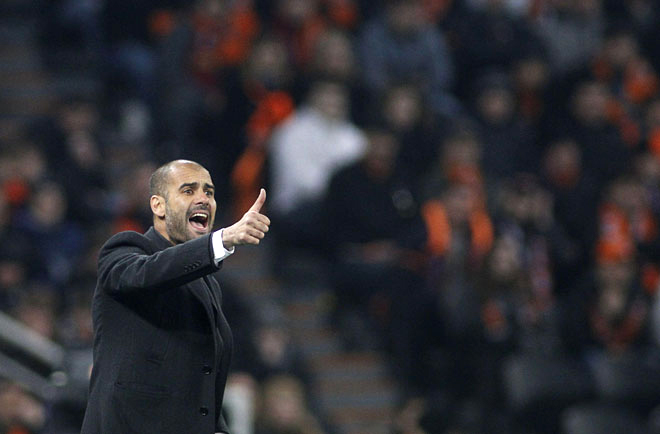 HLV Pep Guardiola chỉ đạo Manchester City thi đấu ở Premier League. Ảnh: AFP