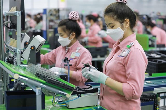 A mobile phone assembly line at Samsung Việt Nam's factory. The company’s export value hit $65.5 billion, up 16 per cent on year. — Photo courtesy of the firm