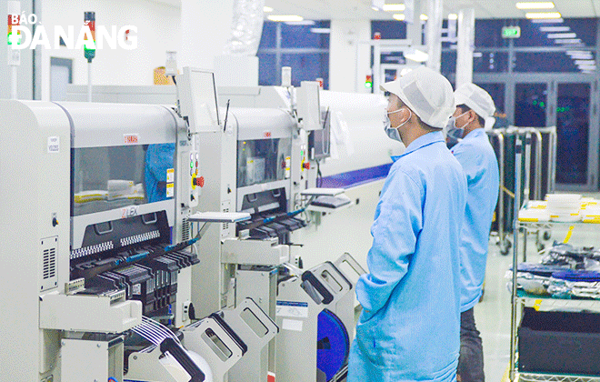 Engineers working at the SMT high-tech electronics manufacturing and assembly factory (Trungnam EMS) located in the Da Nang Hi-Tech Park