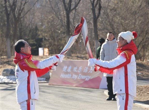 President Nguyen Xuan Phuc said the Olympic flame lit at the National Stadium in Beijing will be a symbol of the sports spirit transcending national boundaries. (Photo: Xinhua/VNA)