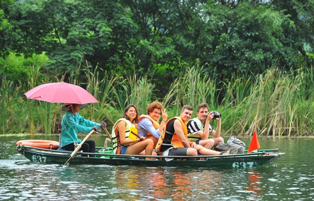 Tourists visit Ninh Bình Province's Tràng An Eco-Tourism site. Việt Nam is a favourite destination for digital nomads who can work from anywhere in the world. — VNA/VNS Photo 