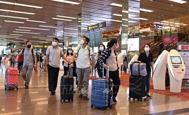 Passengers at Changi International Airport of Singapore (Photo: VNA)