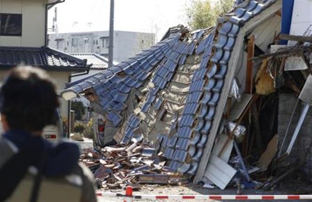A house is destroyed after an earthquake occurs in Kunimi town, Fukushima prefecture, Japan, on March 17, 2022. (Photo: Kyodo/ VNA)