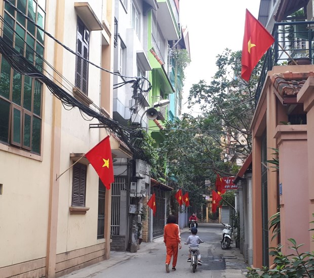 The national flag is hung on an alley in Hanoi on a national holiday. (Photo: VNA)