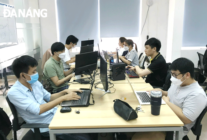 The Bestaff app makes it easier to manage service industry jobs. Employees of Tekup Solutions Co., Ltd. are seem working at the office. Photo: M.QUE