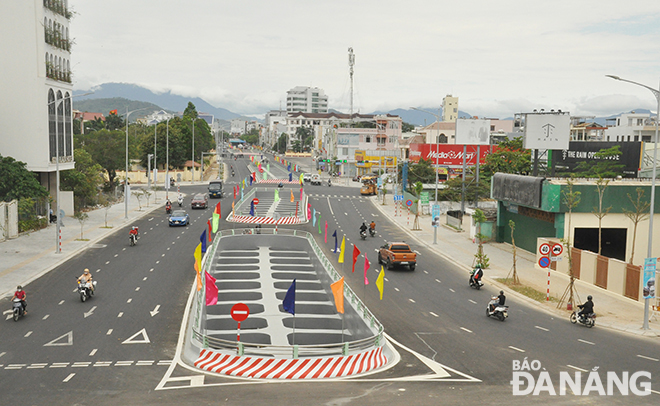 Road users are seen travelling nearby intersections on the inauguration day. Photo: THANH LAN