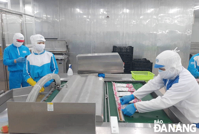 Production activities are observed at SEADANANG company specialising in seafood processing. Photo: KHANH HOA