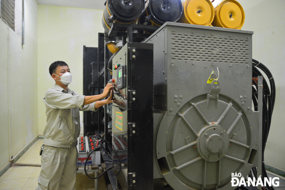 An engineer is seen working at the Mui Trau twin tunnels' generator room.