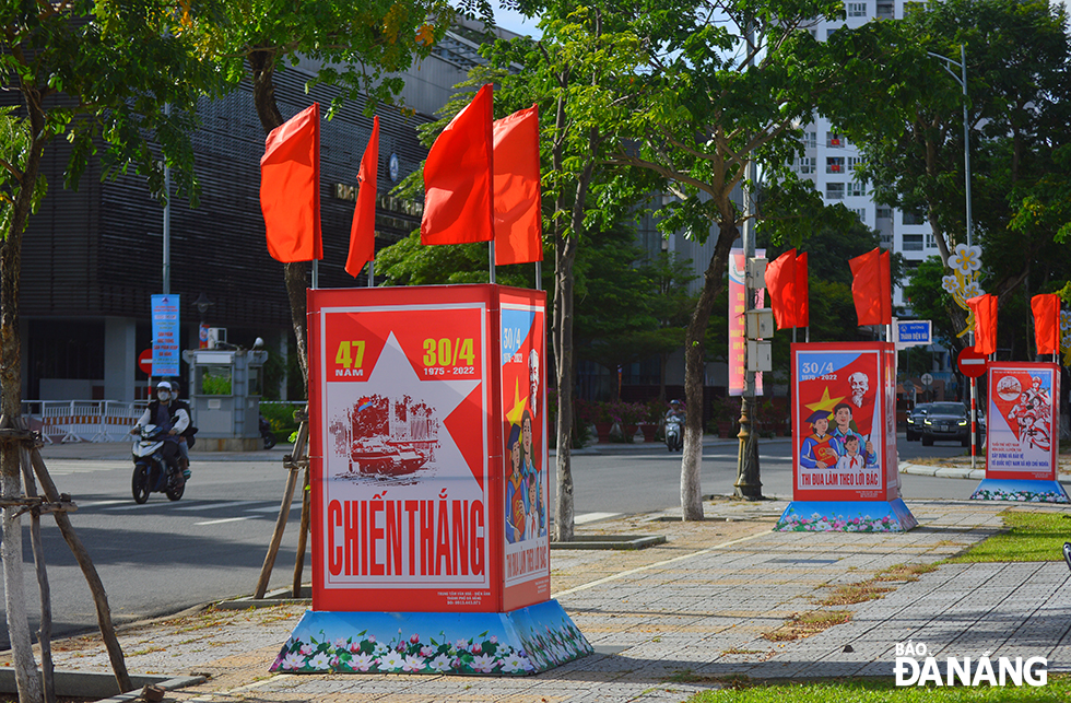 Colourful panels are placed in downtown streets to celebrate the 47th anniversary of the Liberation of the South and and National Reunification Day. Photo was taken on Tran Phu Street.